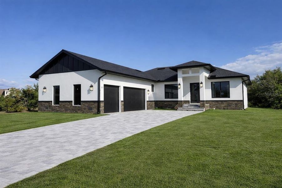 Front exterior of a new home in , Port Charlotte, FL, highlighting curb appeal (Image 13).