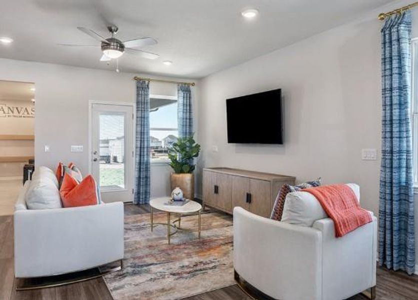 Living area featuring recessed lighting, a ceiling fan, and wood finished floors Living area featuring recessed lighting, a ceiling fan, and wood finished floors