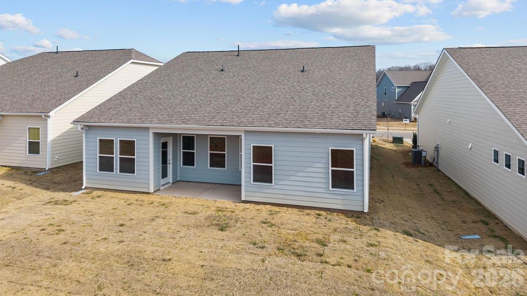 Exterior details and patio area of a home in Cottages at Wingate, Wingate (Image 2). Exterior details and patio area of a home in Cottages at Wingate, Wingate (Image 2).