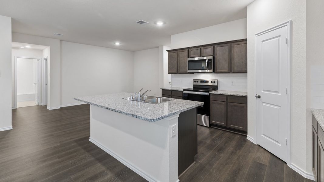 Representative furnished interior of a home built from the X40L Lakeway by D.R. Horton in Valor Farms, Royse City (Image 11).