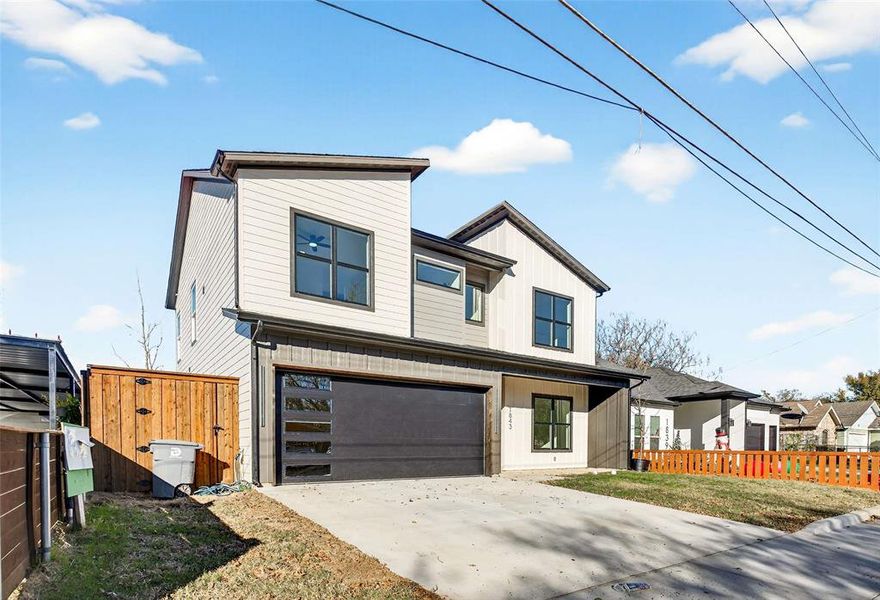 View of front of property with an attached garage, driveway, and board and batten siding View of front of property with an attached garage, driveway, and board and batten siding