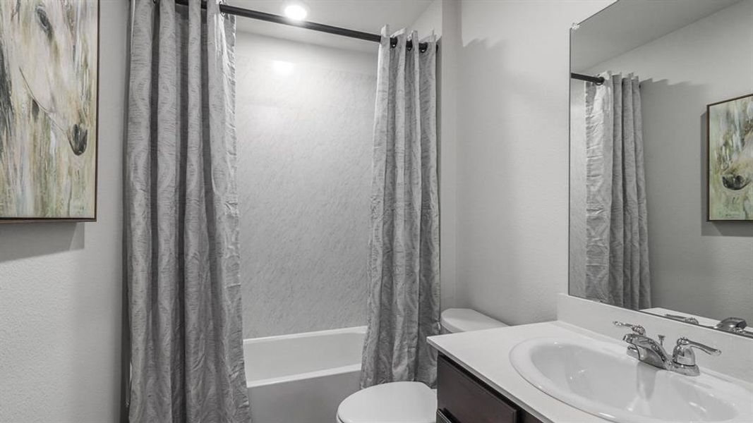 Full bathroom featuring vanity and shower / bath combo