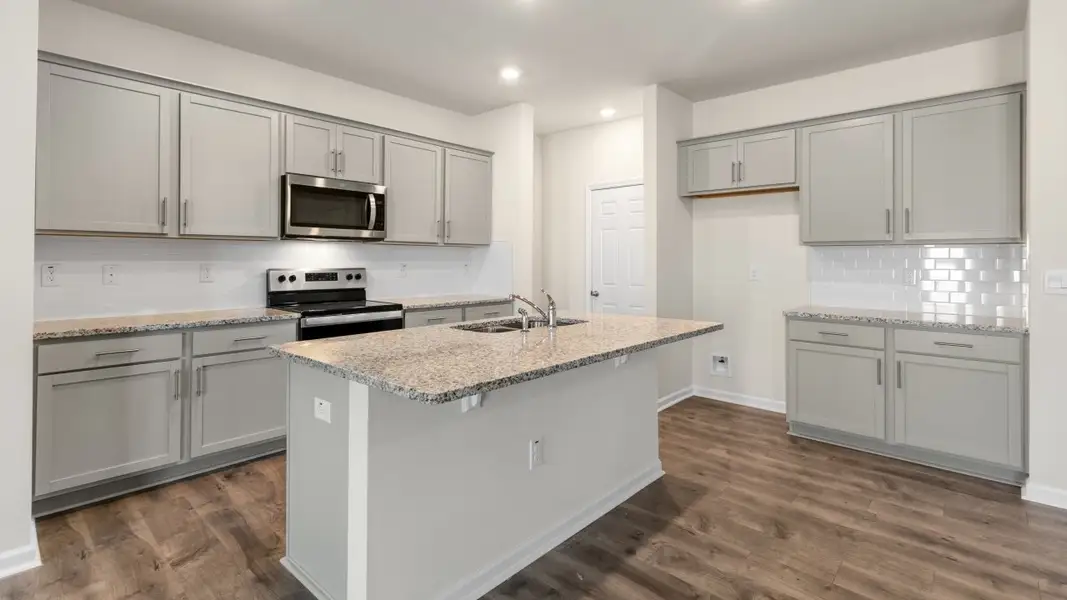 Furnished interior view inside a new home in The Grove at Matthews Landing, Fuquay Varina (Image 4).