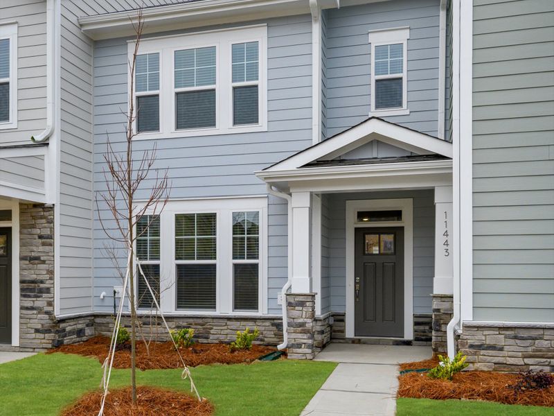 Exterior details and patio area of a home in North Creek Village - Townhomes, Huntersville (Image 19).