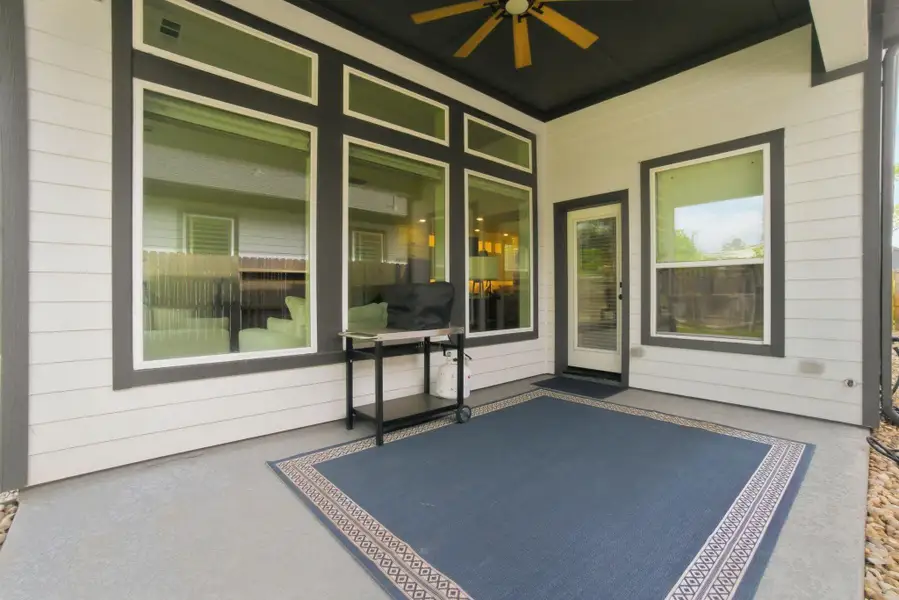 Exterior details and patio area of a home in Woodforest - Kingsley Square 50' Homesites, Montgomery (Image 3).