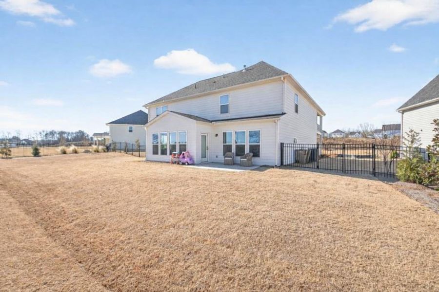 Exterior details and patio area of a home in Reunion, Flowery Branch (Image 36).