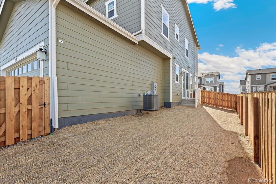 Exterior details and patio area of a home in Turnberry, Commerce City (Image 17).
