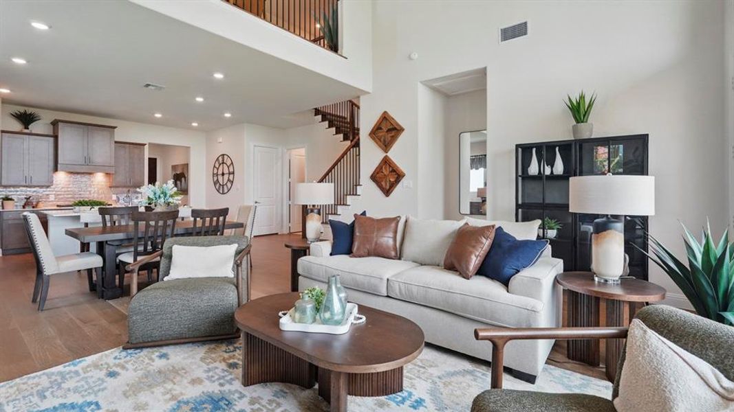 Open-concept living area with wood-finish flooring throughout
