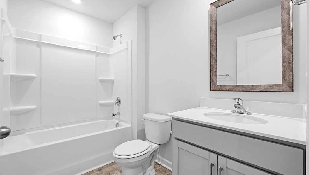 Furnished interior view inside a new home in Lakestone, Woodruff (Image 4).