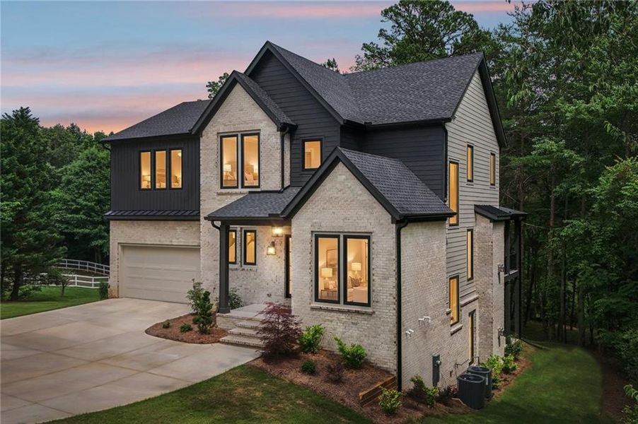 Front exterior of a new home in , Cumming, GA, highlighting curb appeal (Image 34).