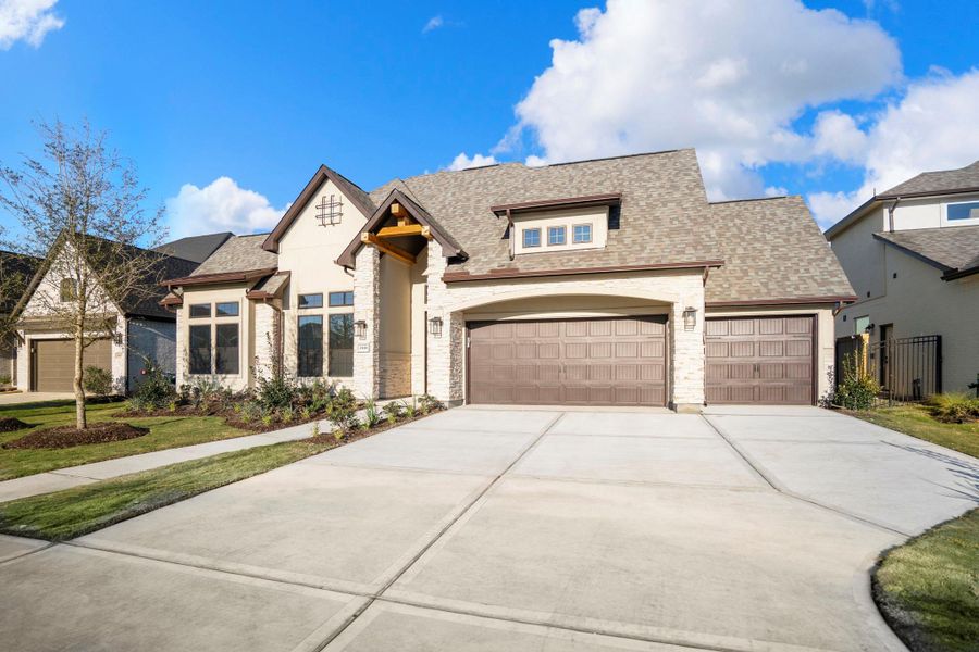 Front exterior of a new home in Jordan Ranch 70' Lots, Fulshear, TX, highlighting curb appeal (Image 25).