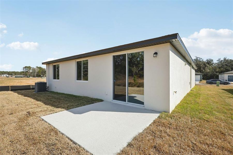 Exterior details and patio area of a home in Leyland Preserve - Classic Series, Brooksville (Image 21).
