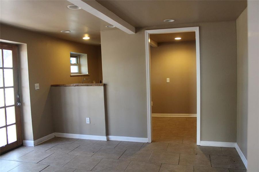 Empty room featuring recessed lighting and light tile patterned floors Empty room featuring recessed lighting and light tile patterned floors