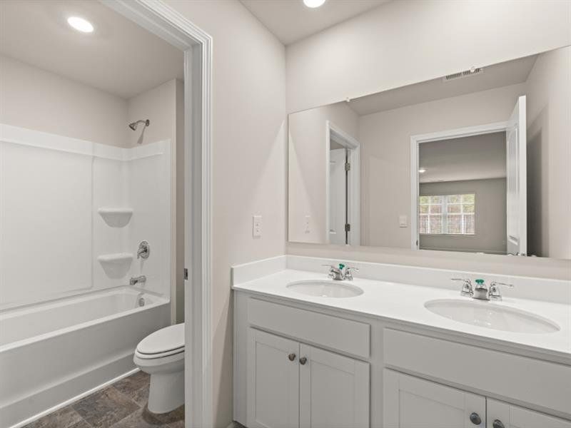 Furnished interior view inside a new home in Northwoods at Mirror Lake, Villa Rica (Image 10).