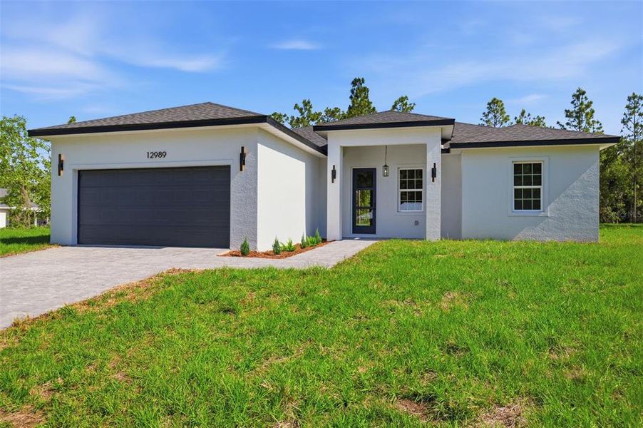 Front exterior of a new home in , Ocala, FL, highlighting curb appeal (Image 21).