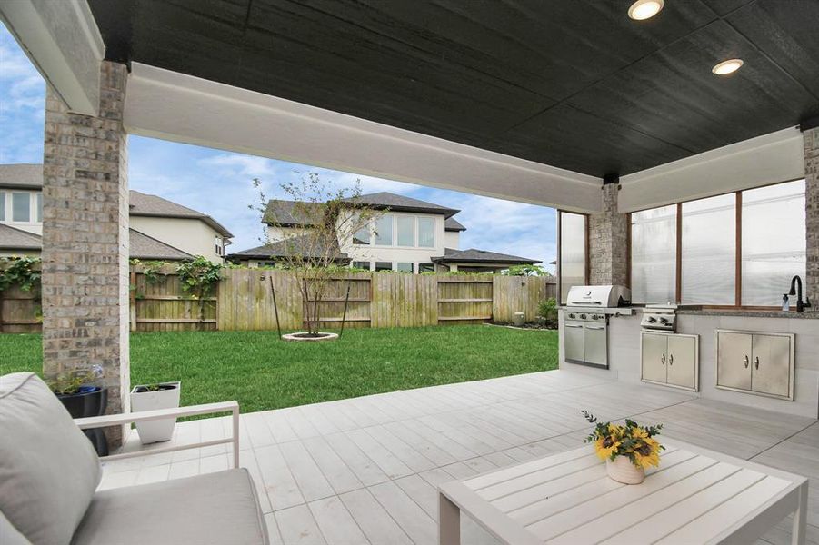 Spacious covered patio awaits you outside of your full sliding double doors that brings the entertaining from outdoors to indoors.