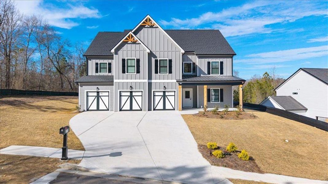 Front exterior of a new home in Silvercrest Lakes, Acworth, GA, highlighting curb appeal (Image 26). Front exterior of a new home in Silvercrest Lakes, Acworth, GA, highlighting curb appeal (Image 26).