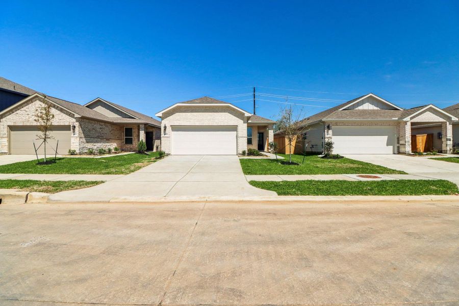 Front exterior of a new home in Sanford Farms - Traditional Series, Conroe, TX, highlighting curb appeal (Image 20).