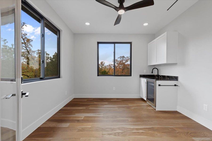 Upstairs Gym/ Flex Room with sink and mini fridge Upstairs Gym/ Flex Room with sink and mini fridge