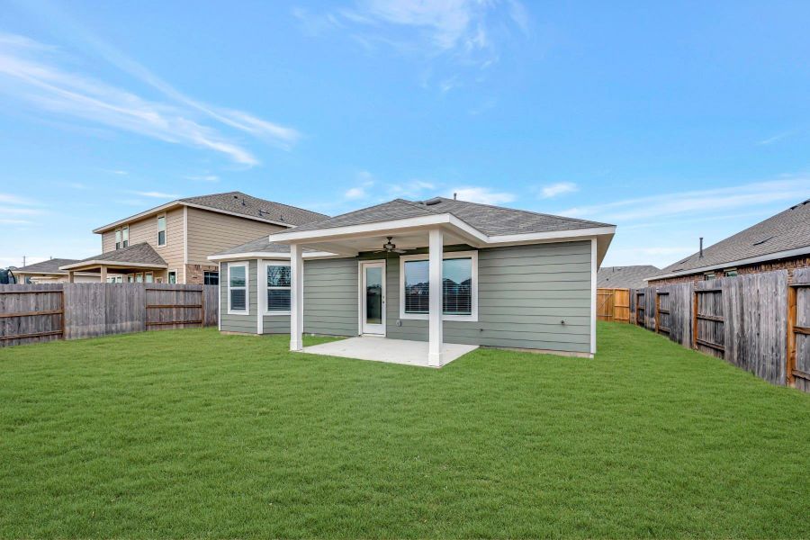 Exterior details and patio area of a home in Pinewood at Grand Texas, New Caney (Image 4).