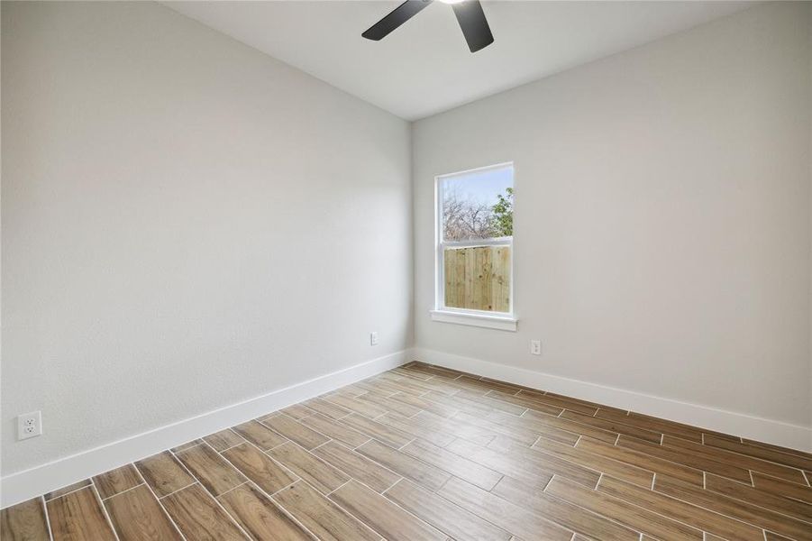 Unfurnished room featuring ceiling fan