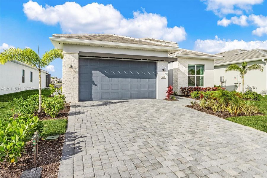 Front exterior of a new home in , Naples, FL, highlighting curb appeal (Image 24). Front exterior of a new home in , Naples, FL, highlighting curb appeal (Image 24).