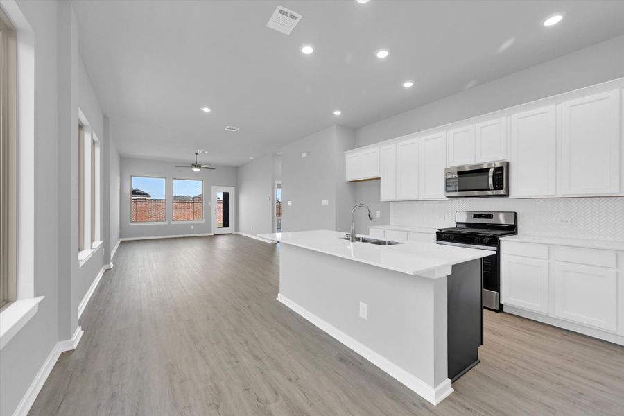 Furnished interior view inside a new home in Sunterra 40, Katy (Image 6).