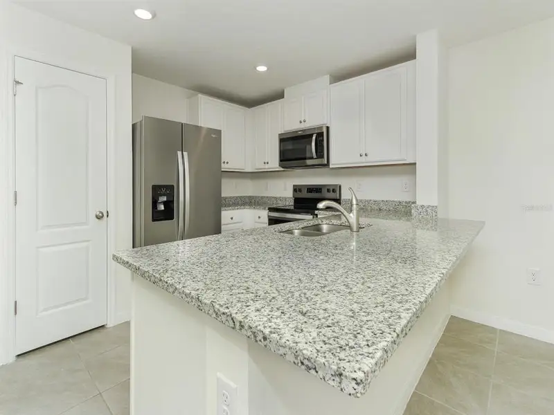 Furnished interior view inside a new home in , Harmony (Image 6).