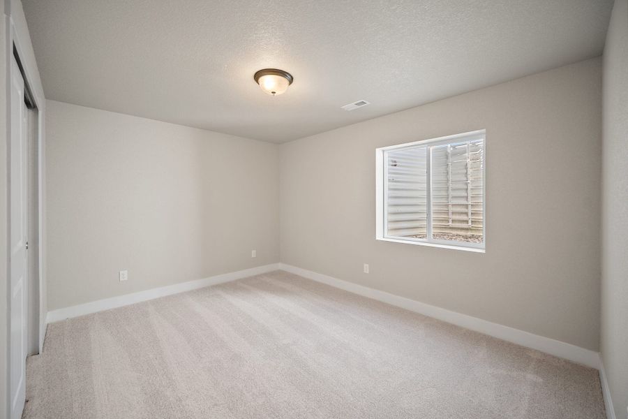 Spacious, unfurnished interior of a new home in The Glen, Colorado Springs (Image 34).