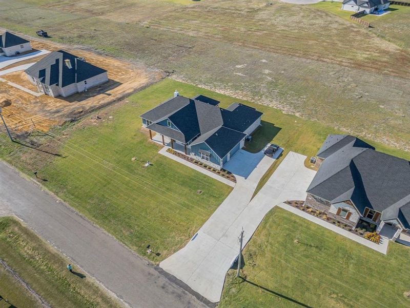 Birds eye view of property featuring a rural view