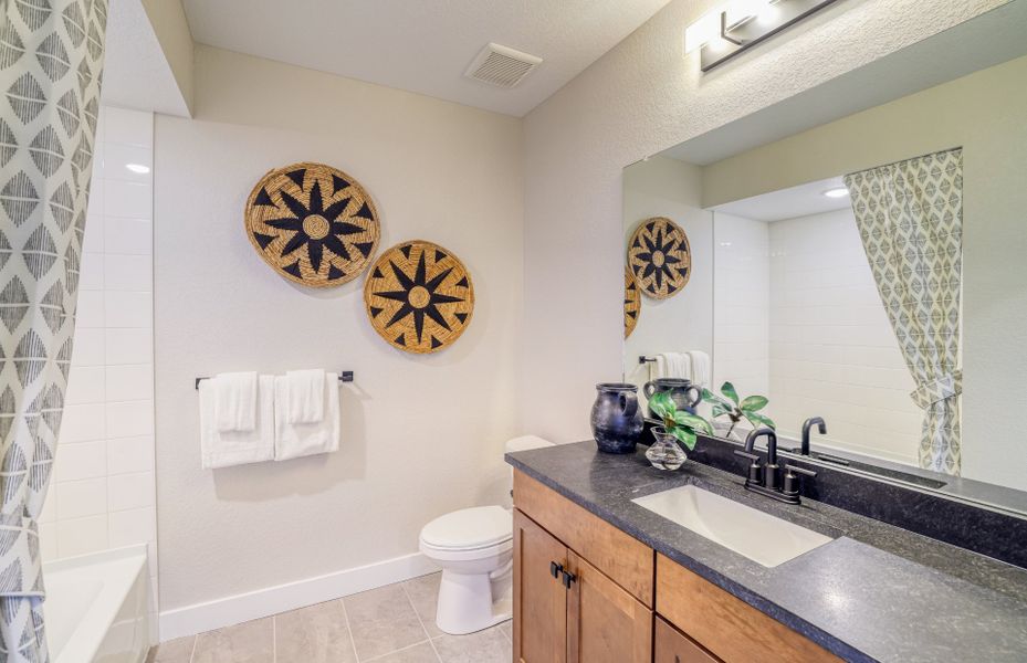 Furnished interior view inside a new home in Hilltop at Inspiration, Aurora (Image 8).