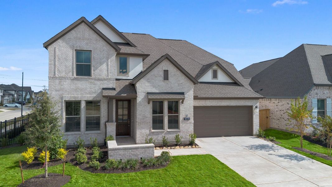 Front exterior of a new home in Bridgeland 55', Cypress, TX, highlighting curb appeal (Image 19).