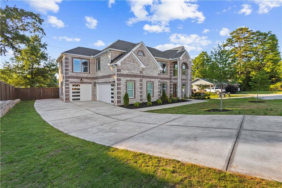 Front exterior of a new home in , Norcross, GA, highlighting curb appeal (Image 2). Front exterior of a new home in , Norcross, GA, highlighting curb appeal (Image 2).