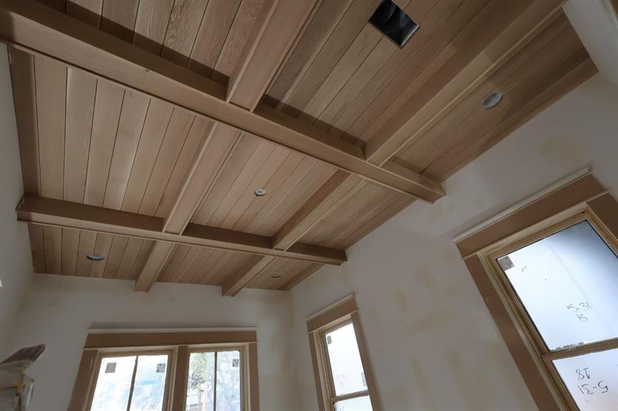 The dining room has a stained white Oak ceiling.