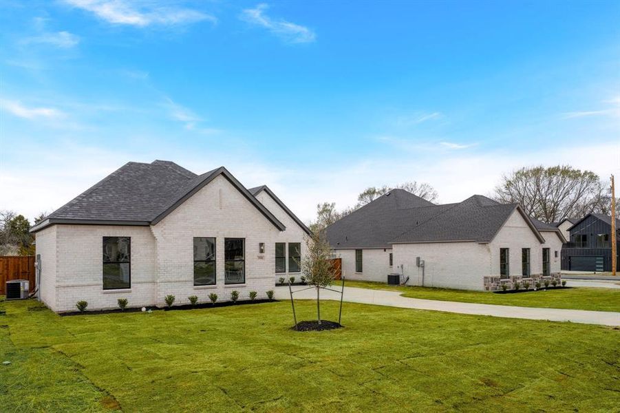 Front exterior of a new home in , Glenn Heights, TX, highlighting curb appeal (Image 19).