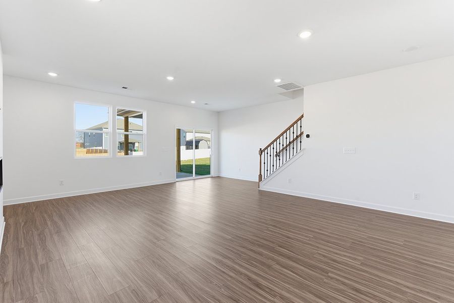 A room with a wood floor and a wood floor.