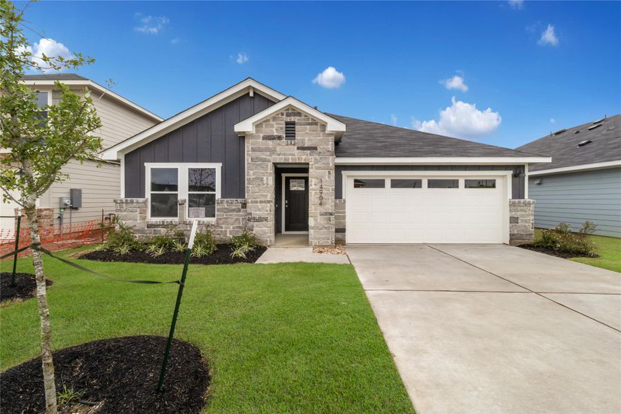 Exterior details and patio area of a home in Monarch Ranch, Manor (Image 2).