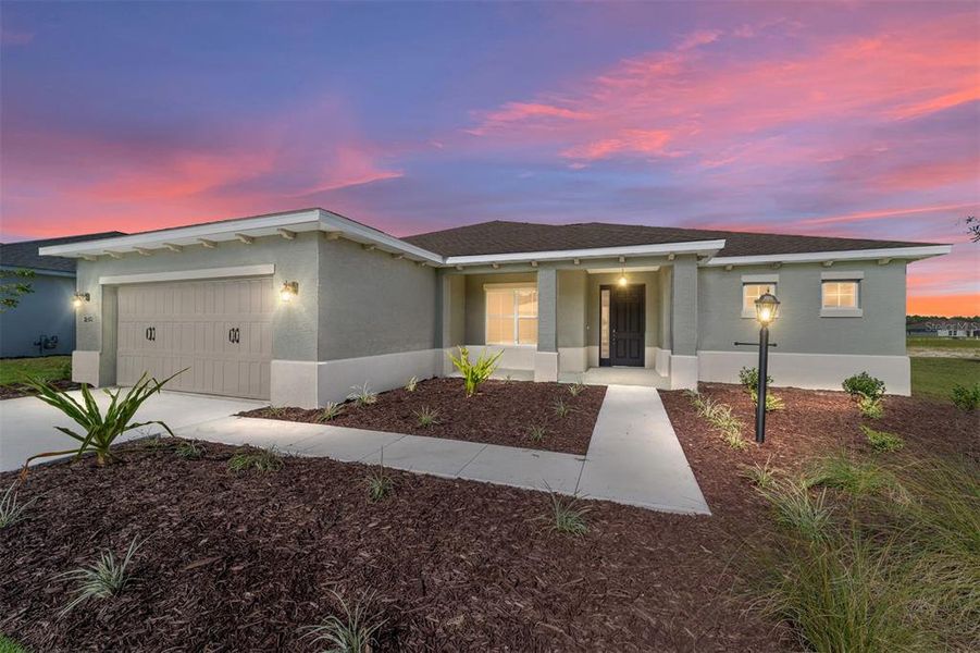 Front exterior of a new home in On Top of the World Communities, Ocala, FL, highlighting curb appeal (Image 17).