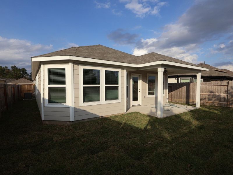 Exterior details and patio area of a home in Pinewood at Grand Texas, New Caney (Image 4).