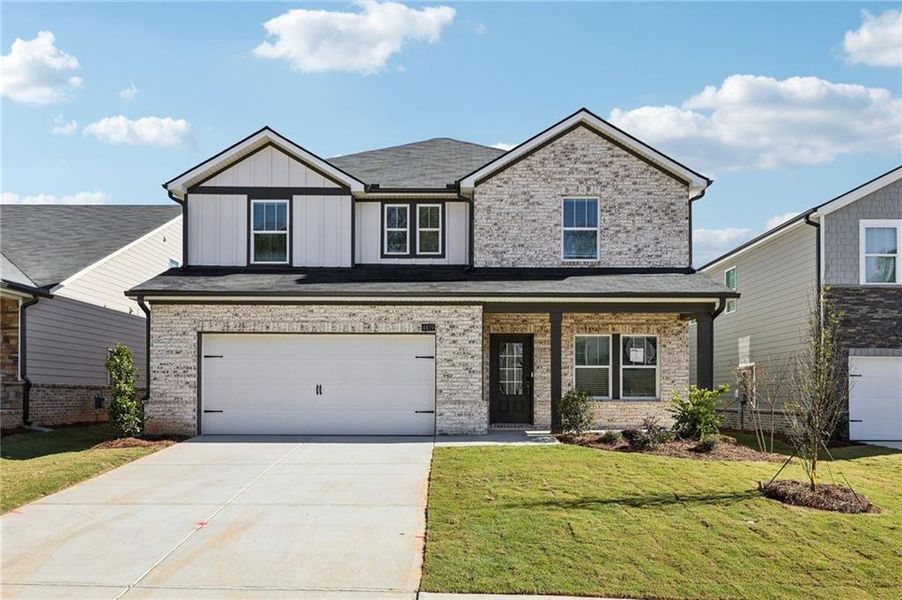 Front exterior of a new home in Westmont Preserve, Powder Springs, GA, highlighting curb appeal (Image 1).