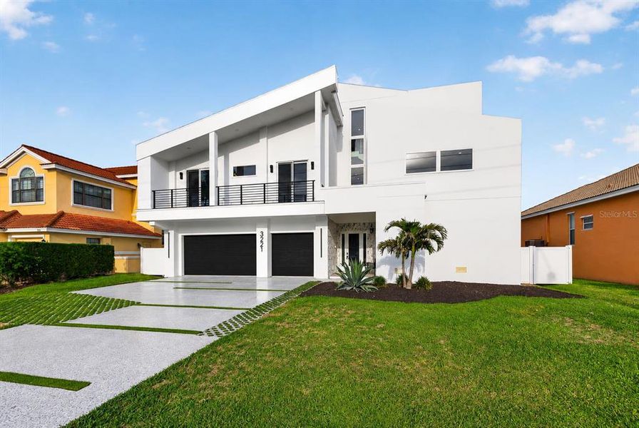Front exterior of a new home in , Belleair Beach, FL, highlighting curb appeal (Image 33).