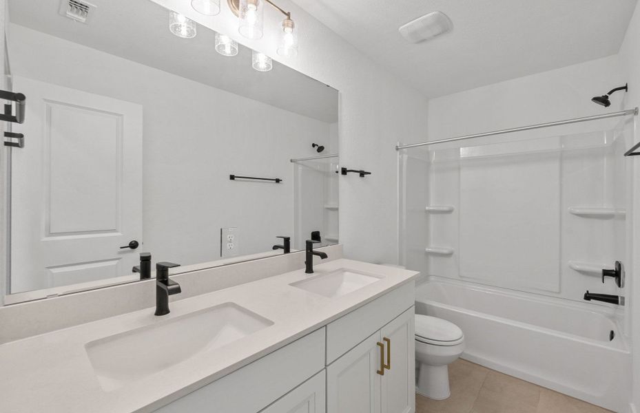 Furnished interior view inside a new home in Wolf Ranch, Georgetown (Image 15).