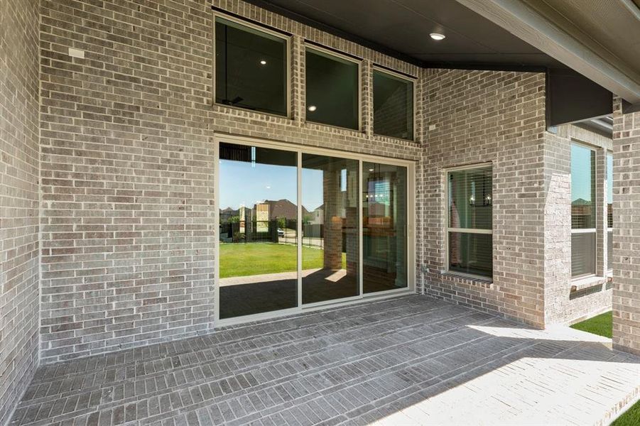 Exterior details and patio area of a home in Cambridge Estates - Harwood, Prosper (Image 3).