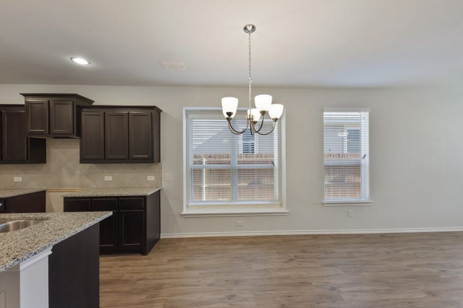 Representative exterior photo of a completed home built from the Cameron by Impression Homes in Heartland, Heartland, TX (Image 8).