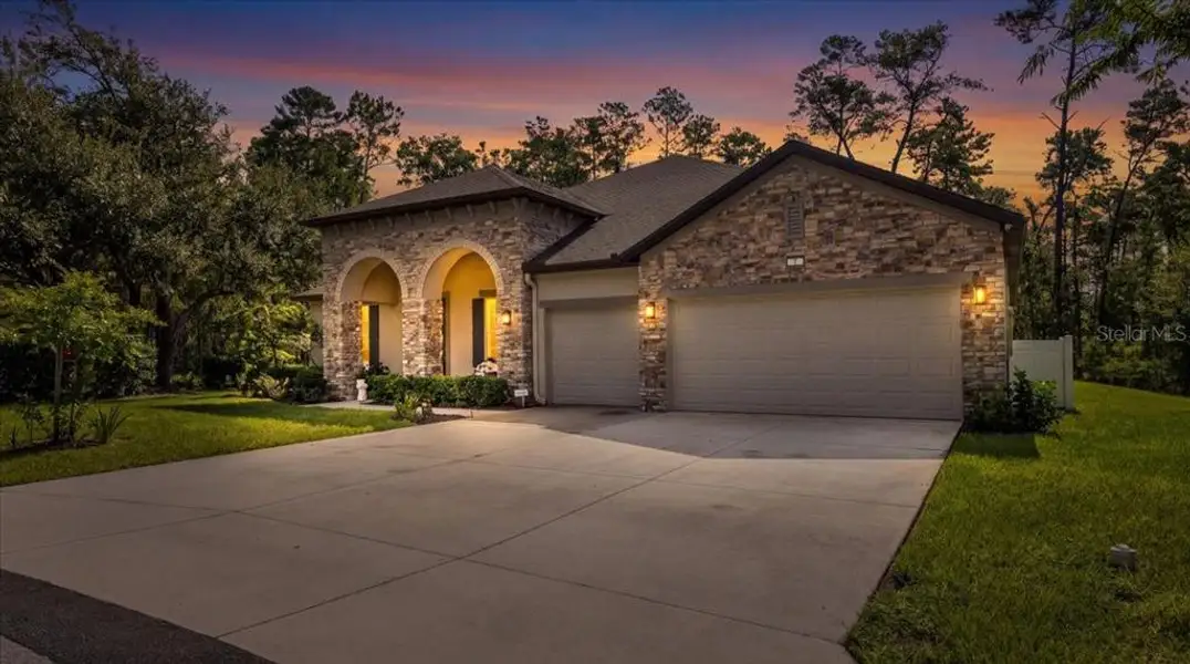 Front exterior of a new home in , Homosassa, FL, highlighting curb appeal (Image 2). Front exterior of a new home in , Homosassa, FL, highlighting curb appeal (Image 2).
