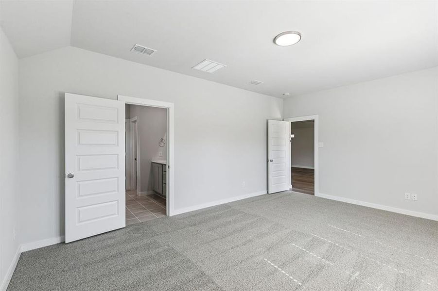 Primary Suite in the Oscar home plan by Trophy Signature Homes – REPRESENTATIVE PHOTO