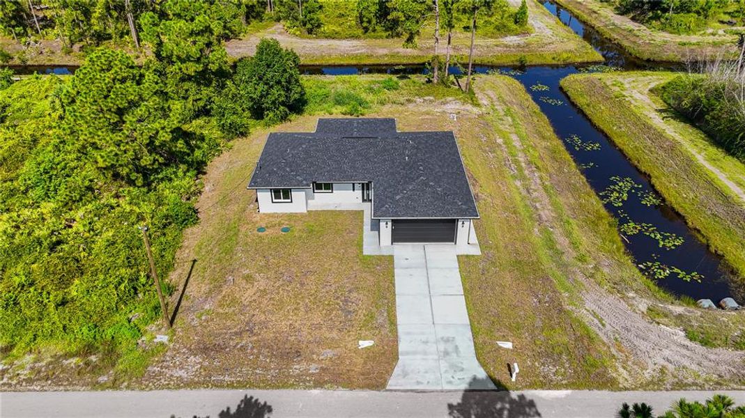 Front exterior of a new home in , Lehigh Acres, FL, highlighting curb appeal (Image 17). Front exterior of a new home in , Lehigh Acres, FL, highlighting curb appeal (Image 17).