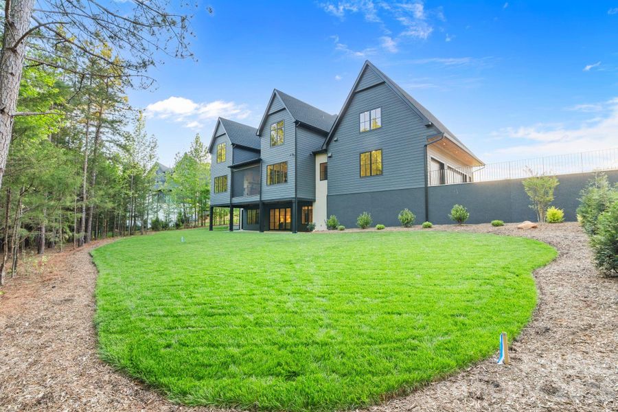 Front exterior of a new home in Cardinal Crest, Weddington, NC, highlighting curb appeal (Image 27). Front exterior of a new home in Cardinal Crest, Weddington, NC, highlighting curb appeal (Image 27).