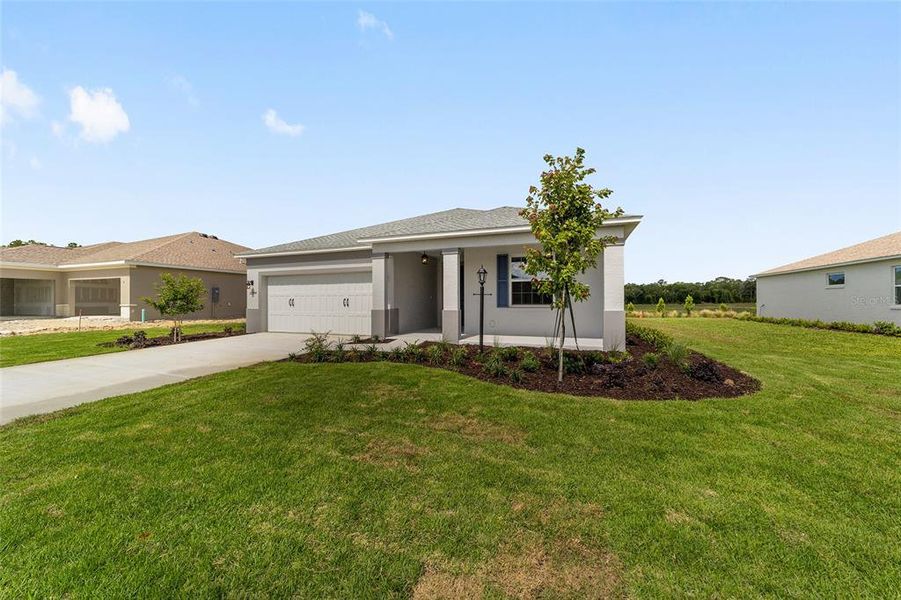Front exterior of a new home in , Ocala, FL, highlighting curb appeal (Image 1). Front exterior of a new home in , Ocala, FL, highlighting curb appeal (Image 1).