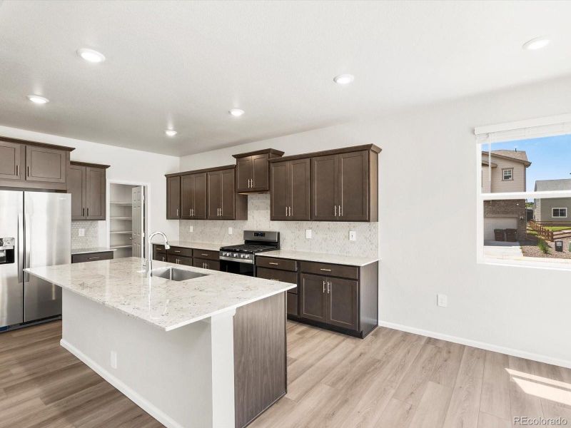 Furnished interior view inside a new home in Poudre Heights: The Alpine Collection, Windsor (Image 11).